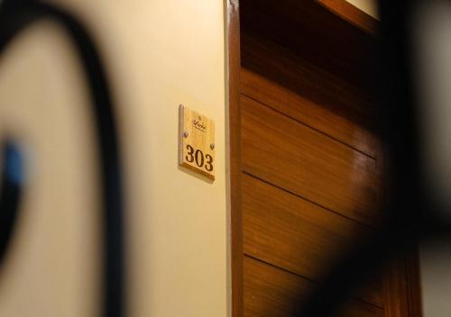 a close up of a door with a sign on it at The Verda De Miranda Resort Morjim North Goa in Morjim