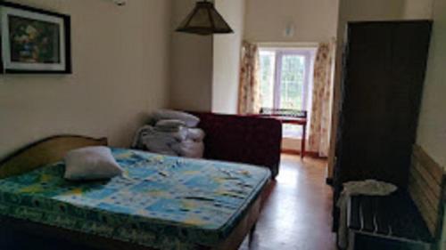 Postel nebo postele na pokoji v ubytování Dew Drops Cottage Coonoor By Lexstays