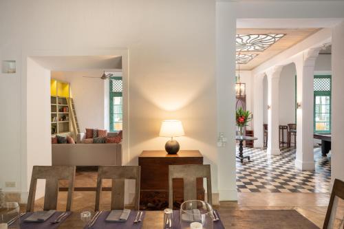 a dining room with a table and chairs at 41 Lighthouse Street in Galle