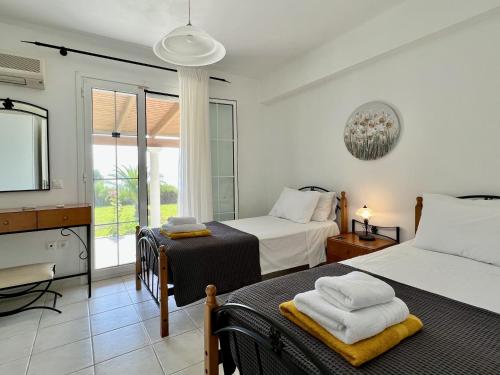 Ένα ή περισσότερα κρεβάτια σε δωμάτιο στο Villa Ermis Spartia Kefalonia