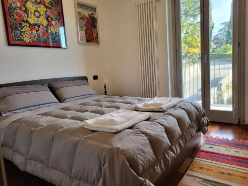 Katil atau katil-katil dalam bilik di Residence Belvedere Apartment Volesio
