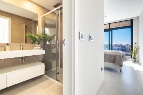 a bathroom with a sink and a mirror at Sunset Waves 3-194 Poniente Beach Resort in Benidorm