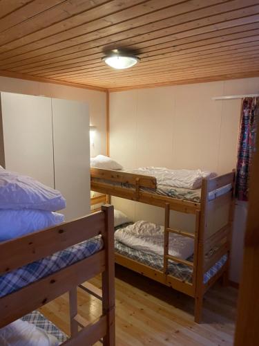 a room with three bunk beds in a room at Fagertoppen 6B in Trysil