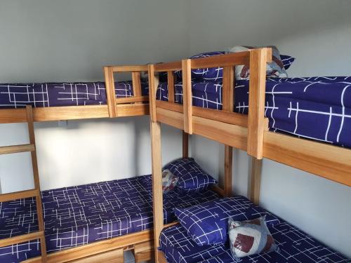 a bunk bed with blue beds in a room at Hostel da Residencia in Salvador