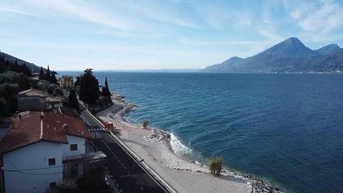an aerial view of a beach and the ocean at Haus and Beach in Brenzone sul Garda