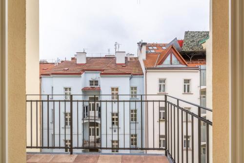 a view of a white building from a balcony at Petrin Tower Residence in Prague