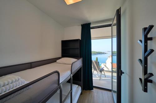 Postel nebo postele na pokoji v ubytování Kuća Bella