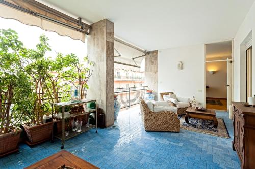 a living room with a couch and a table at Casa Azul in Sorrento