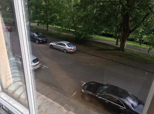 a view of two cars parked in a parking lot at Perfect In The Park in Glasgow