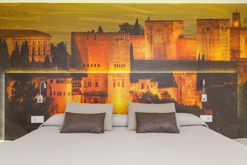 Ένα ή περισσότερα κρεβάτια σε δωμάτιο στο Hotel Maciá Granada Five Senses Rooms & Suites