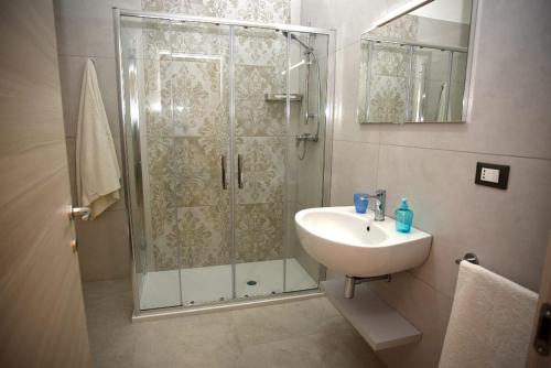 a bathroom with a shower and a sink at Angelo Bianco Appartment in Porto Cesareo