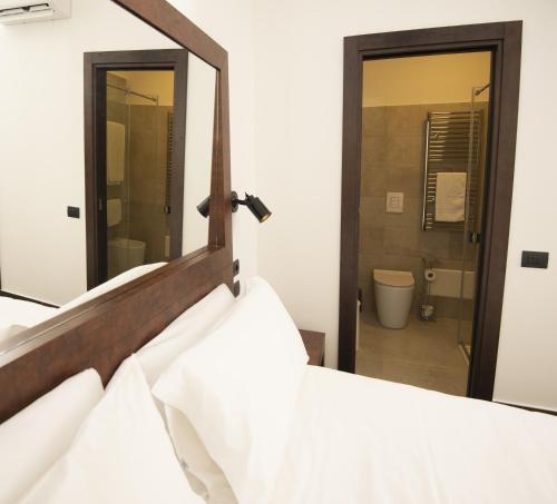 מיטה או מיטות בחדר ב-Domus Altana