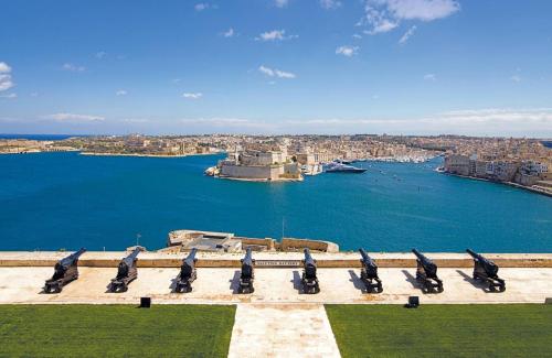 a view of a large body of water at Comfy 2 BR Flat in the Heart of Valletta in Valletta