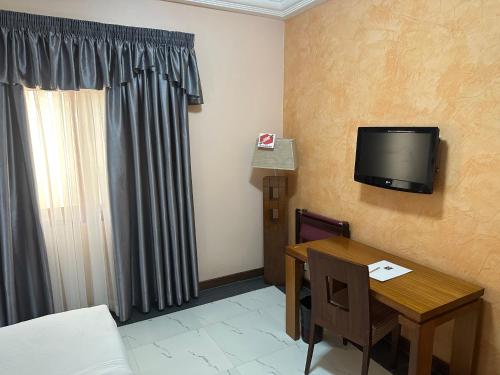 Μια τηλεόραση ή/και κέντρο ψυχαγωγίας στο Hotel Fleur De Lys Almadies