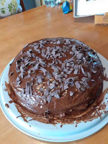a chocolate cake on a plate on a table at 14-18 Somme Chambres in Beaucourt-sur-lʼAncre