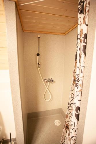 a shower in a bathroom with a shower curtain at 2BR Apt / Central / Tórshavn in Tórshavn