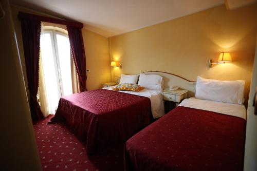 Postel nebo postele na pokoji v ubytování Grand Hotel Osman