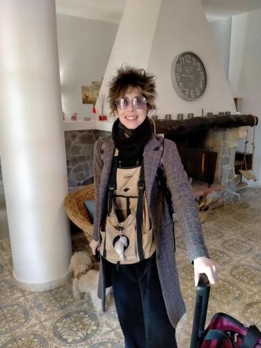 a young child standing in a room with a suitcase at Villa Anna GuestHouse in Brindisi