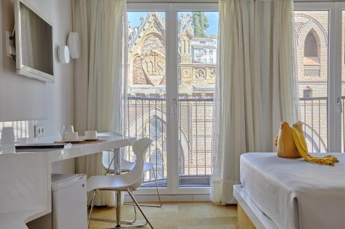 Ένα ή περισσότερα κρεβάτια σε δωμάτιο στο Hotel Maciá Granada Five Senses Rooms & Suites