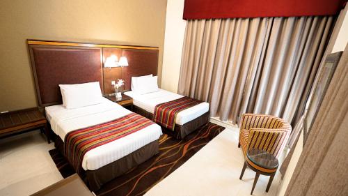  Xclusive Hotel Apartments -  Room  picture :   Tea/Coffee maker    Shower    Bath                           