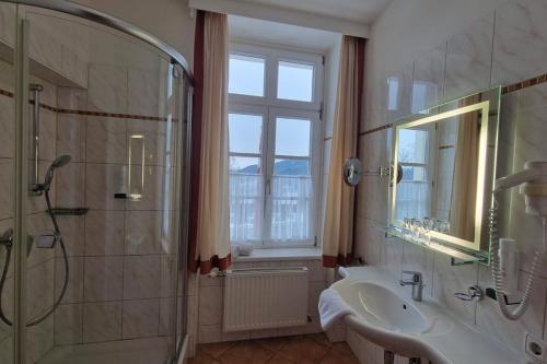 a bathroom with a sink and a shower and a sink at Kirchenwirt in Maria Schutz in Schottwien