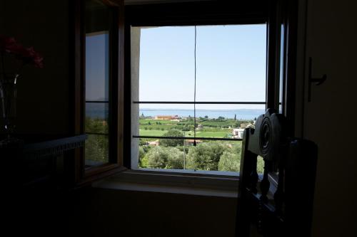 a window in a room with a view of a field at Agriturismo Tenuta la Pergola in Bardolino