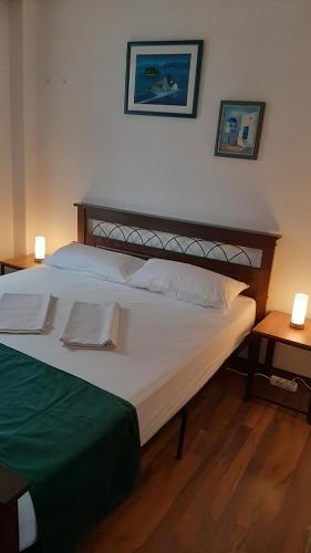Postel nebo postele na pokoji v ubytování Dennis Apartment