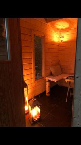 a small room with a bench and a window at Lovely cabin with a beautiful view over Byske river in Byske