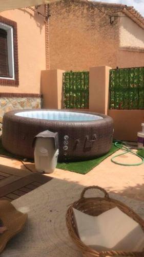 a swimming pool in a backyard with a building at Casa Rural con encanto Señorio Manchego ALBACETE in Yeste