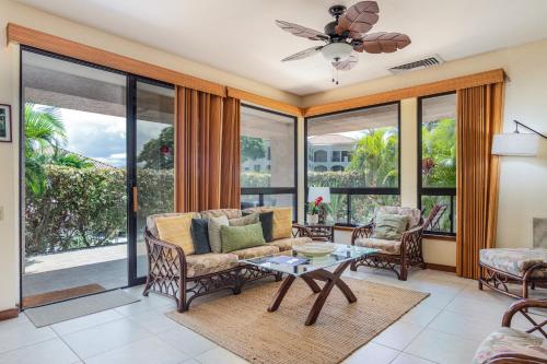 a living room with a couch and a table at Shores at Waikoloa #108 in Waikoloa