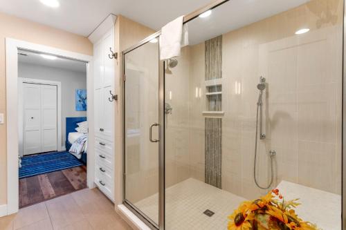 a bathroom with a shower with a glass shower stall at City Center Sanctuary in Estes Park