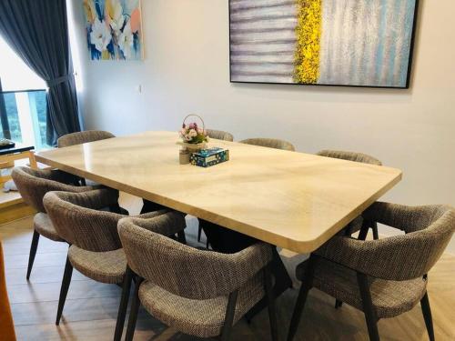 a conference room with a wooden table and chairs at Lumi Tropicana, Petaling Jaya 01 Golf View in Petaling Jaya