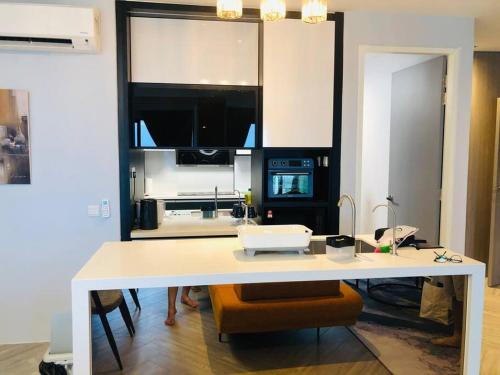 a kitchen with a large white counter top in a room at Lumi Tropicana, Petaling Jaya 01 Golf View in Petaling Jaya