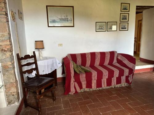 a living room with a couch and a table at La casa nel Castello in Canneto