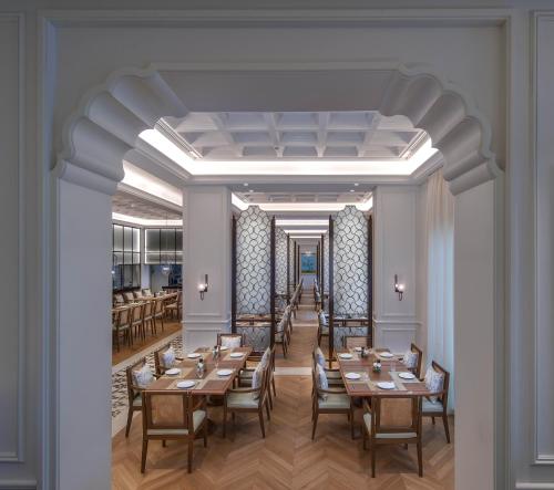 a rendering of a dining room with tables and chairs at The Chedi Katara Hotel & Resort in Doha