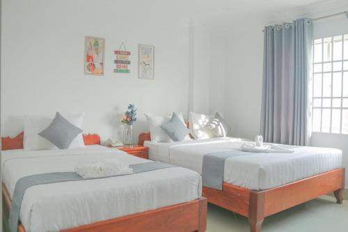 Postel nebo postele na pokoji v ubytování White Corner Hotel