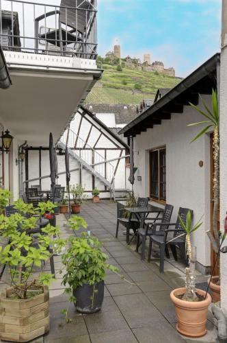 a balcony with a large boat on top of a building at Winzerhof Brachtendorf in Alken