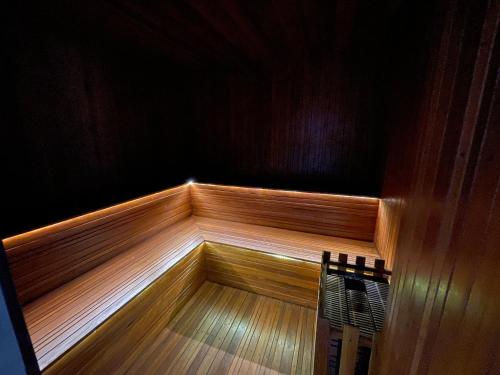 a corner of a wooden sauna with a book at Studio Time 1312 - Luxo - Ponta Verde - Maceió-AL in Maceió