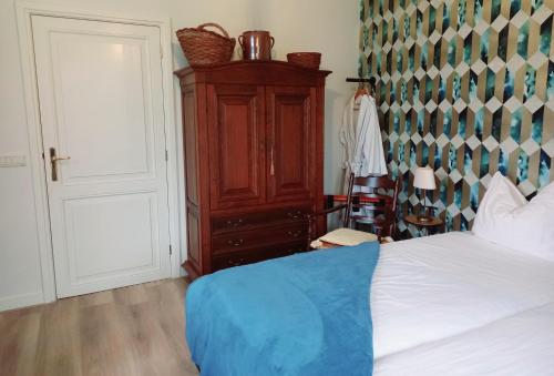 Ένα ή περισσότερα κρεβάτια σε δωμάτιο στο Bed & Breakfast de Wandhorst