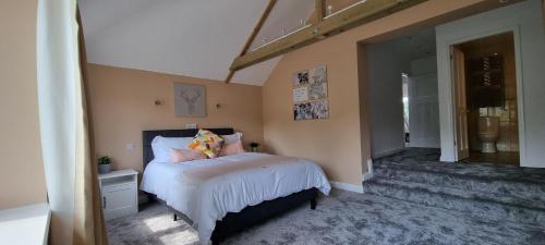 a bedroom with a bed with pillows on it at Walnut Tree View in Oxford