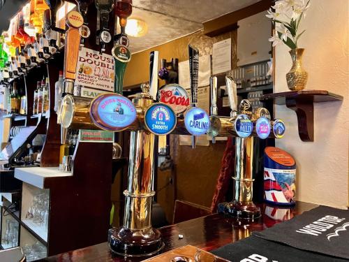 a bar with a bunch of buttons on the counter at The Brunswick Hotel in Bridlington