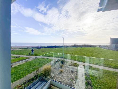a view of a field from the window of a house at 4 Sea View Walk, Pakefield in Pakefield
