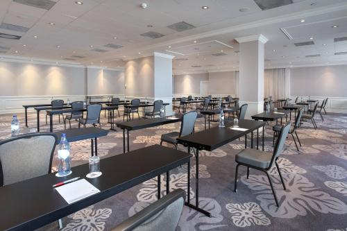 a large room with tables and chairs in it at Lisbon Marriott Hotel in Lisbon