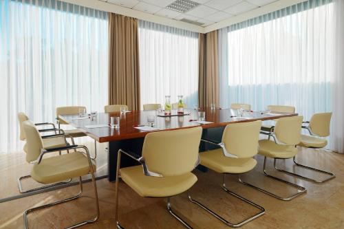 a conference room with a large table and chairs at Lisbon Marriott Hotel in Lisbon