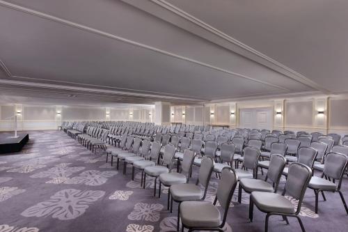 a large room with chairs and a podium in it at Lisbon Marriott Hotel in Lisbon