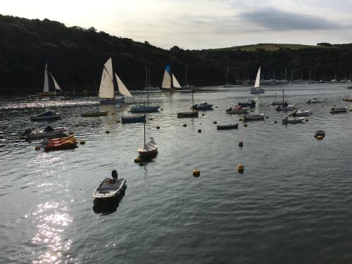 a group of boats in a large body of water at Sandpiper in Fowey