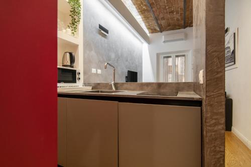 a kitchen with a sink and a counter top at Urbanflat Repubblica Square in Rome