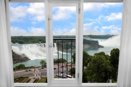 a window with a view of niagara falls at Sheraton Fallsview Hotel in Niagara Falls