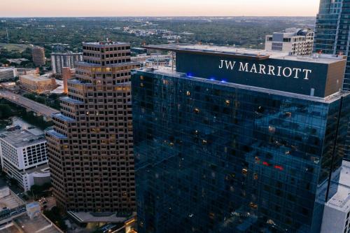 a large building with a sign on top of it at JW Marriott Austin in Austin