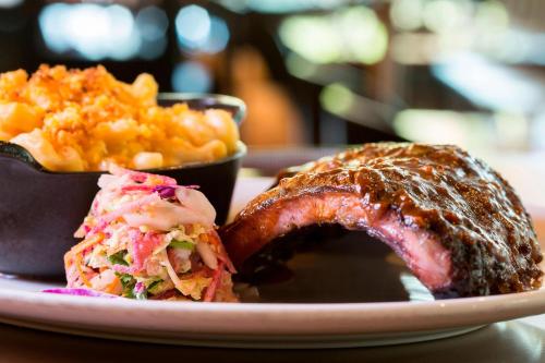 a plate of food with a sandwich and coleslaw at JW Marriott Austin in Austin